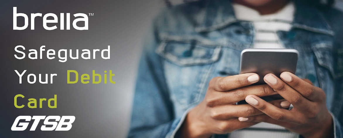 A person using a smartphone, with text promoting Brella debit card protection from GTSB.